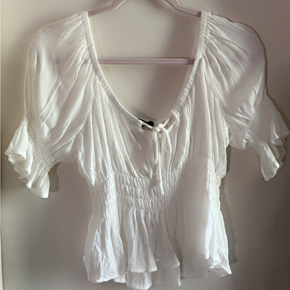 White puff-sleeved peplum blouse